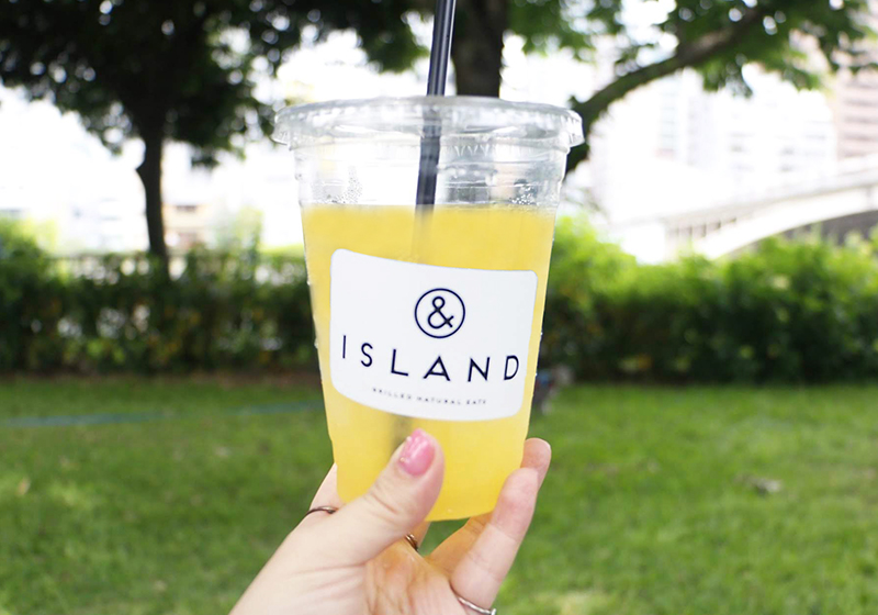 Takeout drinks from & Island on a picnic in Nakanoshima Park
