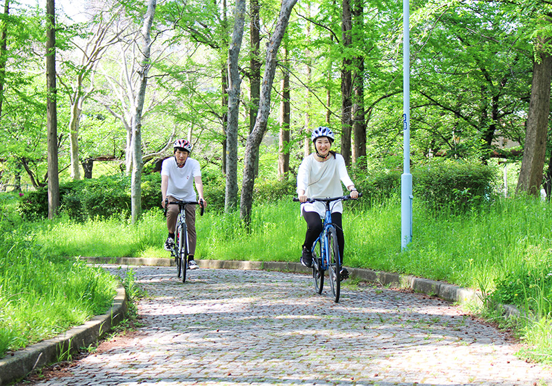cycling in Osaka on a riverside bike path