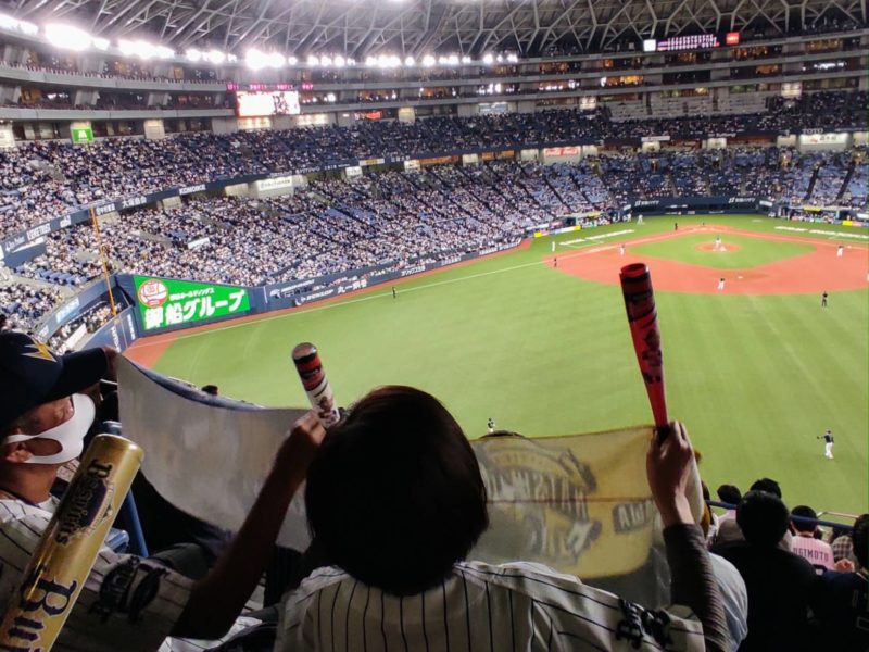 Baseball fans cheering Japan Series at Osaka's Kyocera Dome