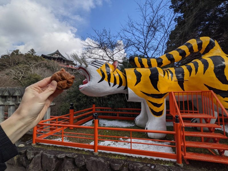 Tiger shaped sweets and tiger statue at Shigisan Temple in Nara