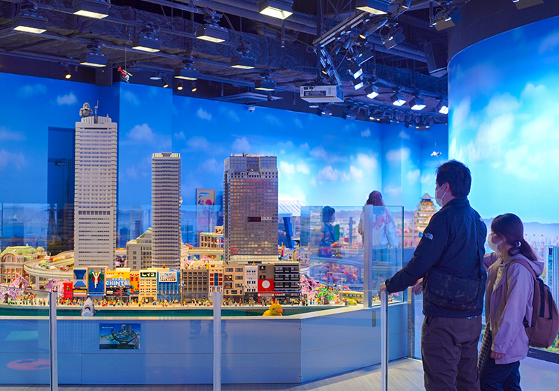 visitors to Legoland Discovery Center Osaka enjoying the city of Osaka in miniland