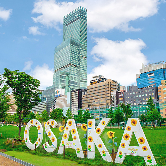 giant Osaka letter sign in front of Abeno Harukas, tall building with observation deck in Tennoji