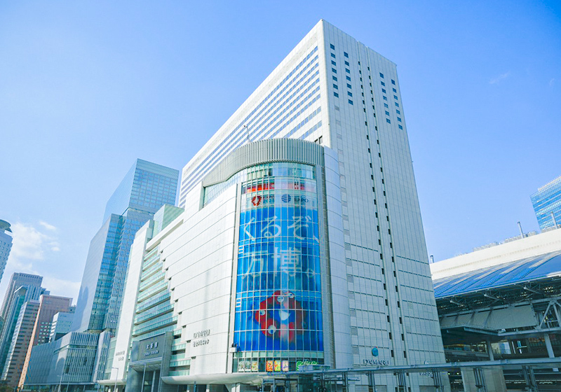 Expo 2025 building wrapping promotional advertising at Osaka Station City’s South Gate Building