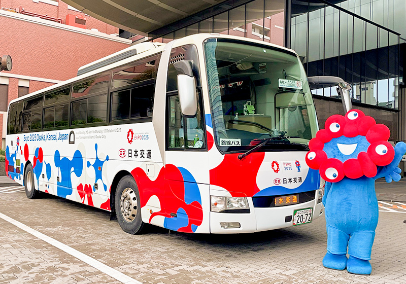 Myaku-Myaku, Osaka Expo’s mascot, and an Expo wrapped bus