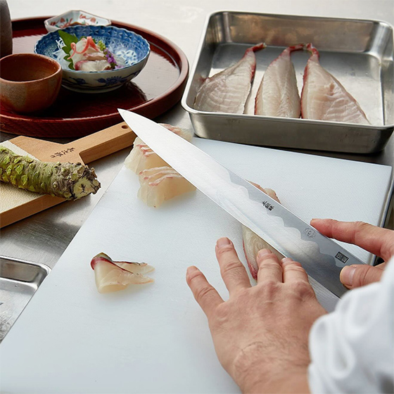 slicing sashimi with a Japanese knife