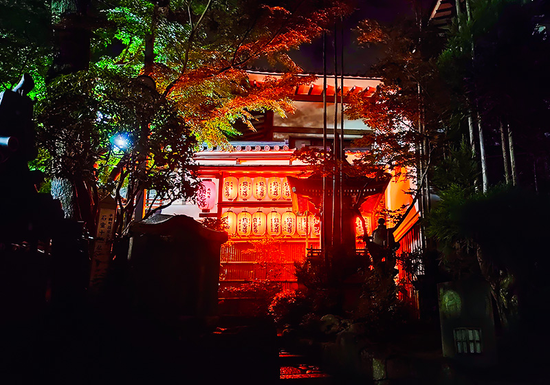 temple buildings glowing red with lanterns at Shigisan Temple in Nara